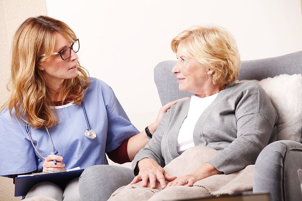 A clinician speaking with an older patient